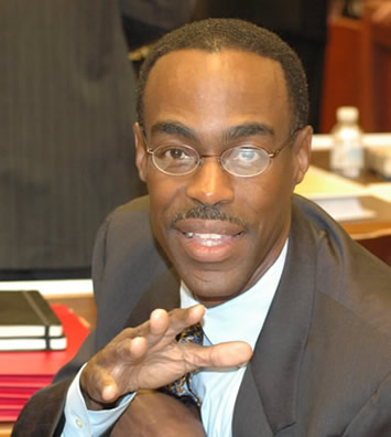 Above: Robert Runcie, Chief Technology Officer of the Chicago Public schools (at the June 27, 2007 Board of Education meeting) had overall responsibility for IMPACT. A friend of CEO Arne Duncan, Runcie (at a salary of $165,000 per year, plus possible “performance” bonuses) was the third highest paid employee of CPS during the 2006-2007 school year (after CEO Duncan and “Chief Education Officer” Barbara Eason Watkins). Every month, the Chicago Board of Education votes to fire teachers and other employees, but despite the expensive IMPACT crash, in October Runcie was still working. Substance photo by George Schmidt.